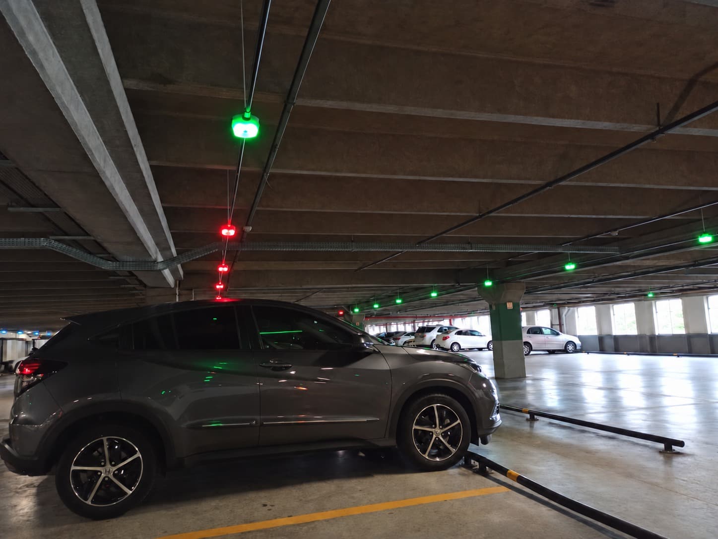 Green and red indicator sensors installed above parking spaces
